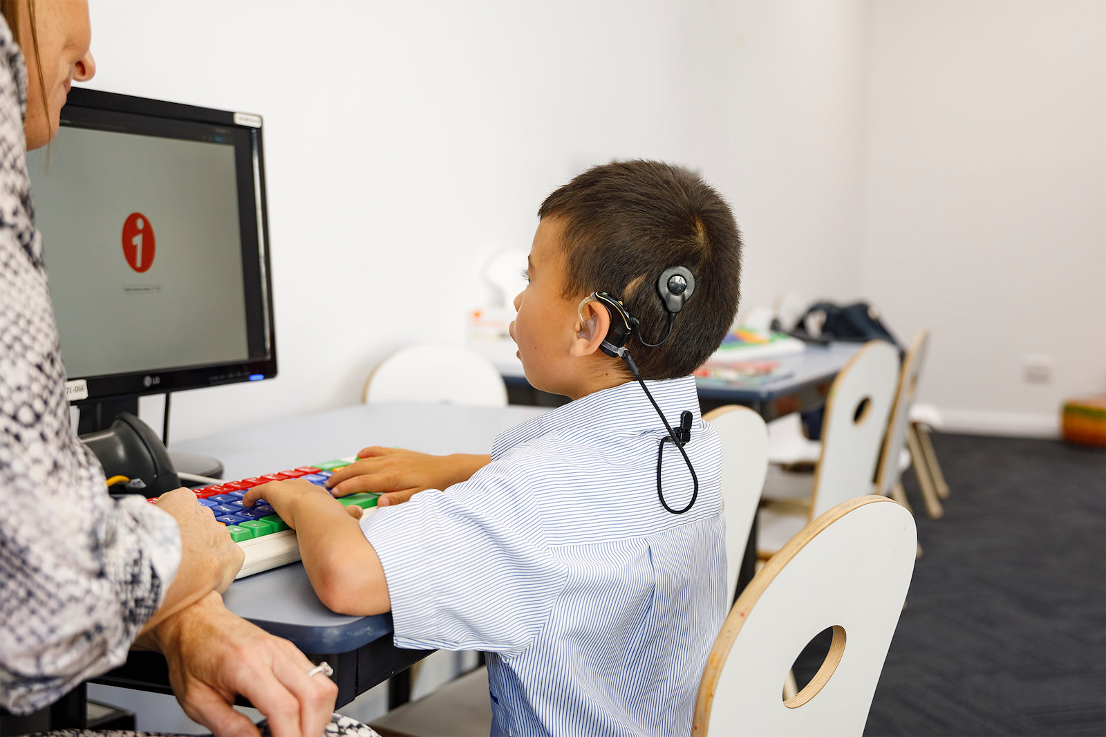 A child using speech and hearing software.