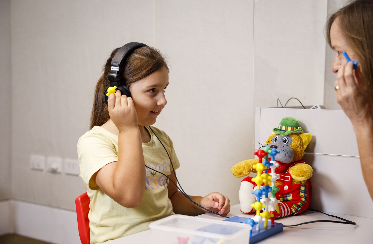 A child undergoing an APD test with headphones on.