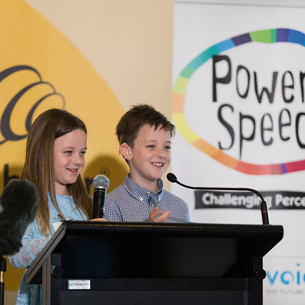 Two children emcees speaking at the TSH Power of Speech event